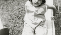 Shirley Schlanger as a child on a slide