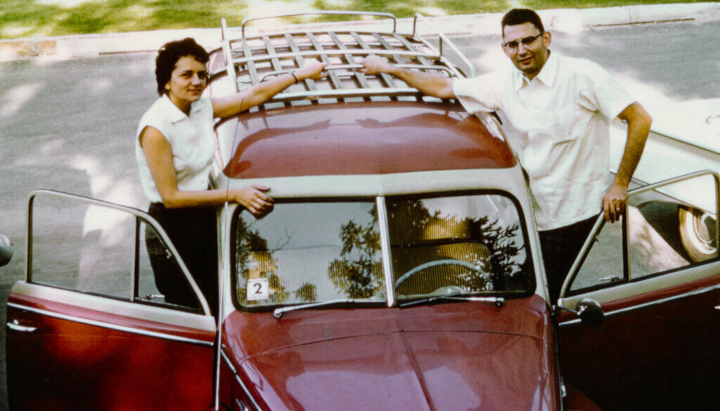 Shirley and Seymour Abrahamson with (possibly) their first car.