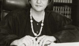 Justice Abrahamson sitting at a desk