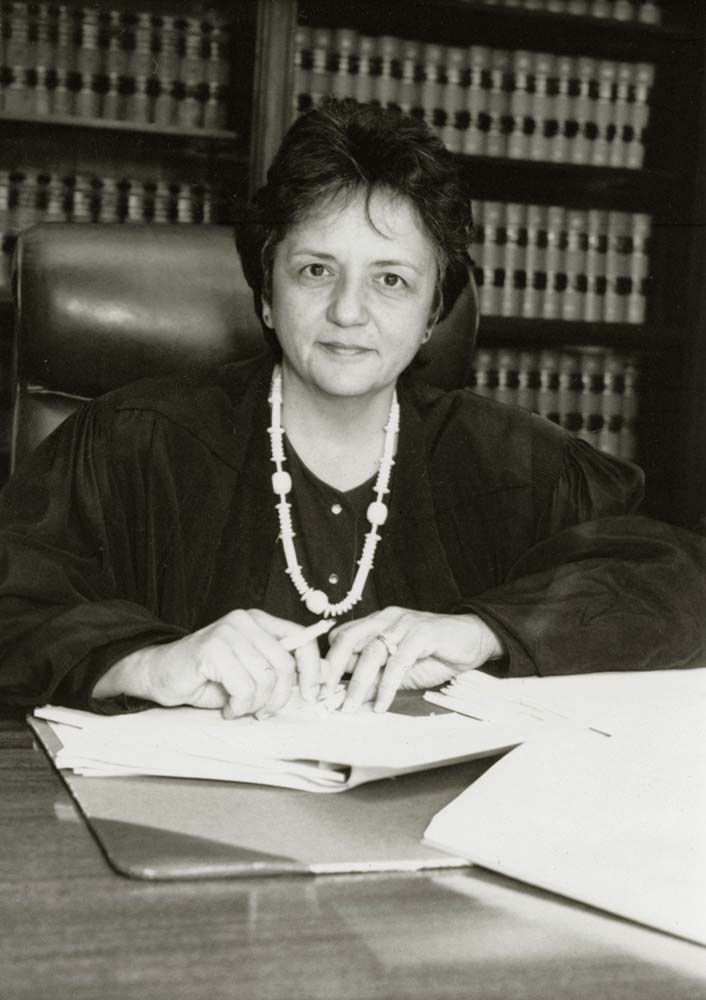 Justice Abrahamson sitting at a desk