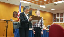 Chief Justice Abrahamson presenting an award to a child